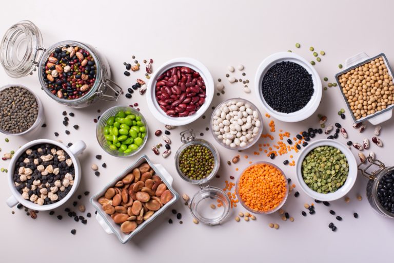 Legumes, lentils, beans. Variety of healthy vegan, plant based protein source and body building food. View from above